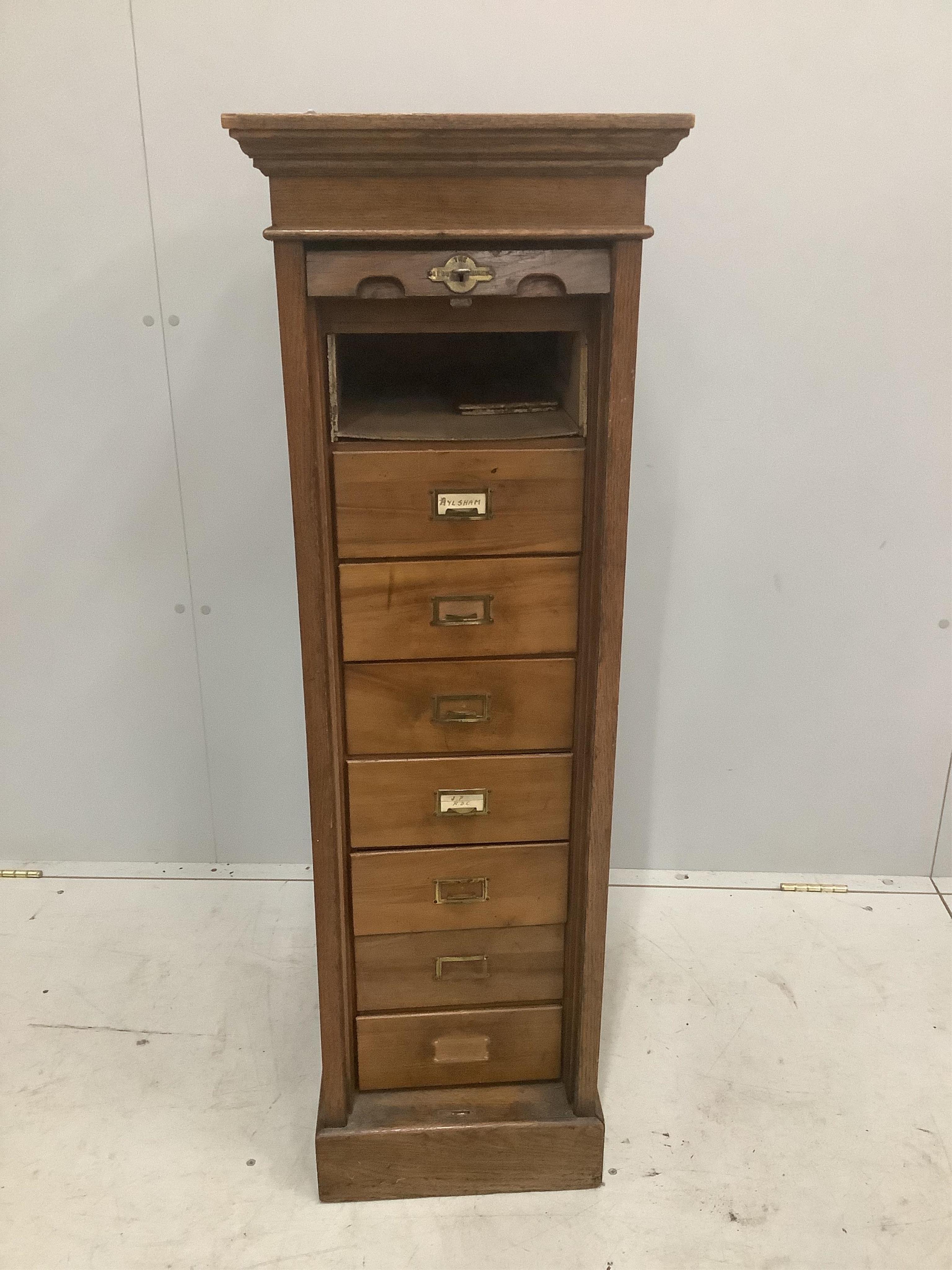 An early 20th century oak Lebus tambour filing cabinet, width 37cm, depth 49cm, height 116cm. Condition - poor to fair